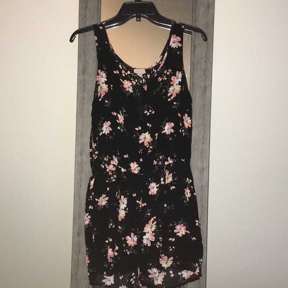 Black, with white and pink flowered jump suit.